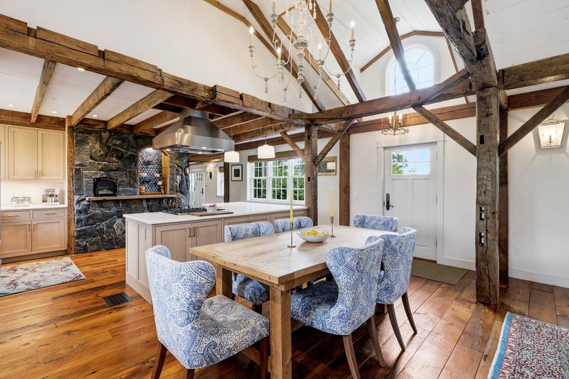 Dining room with cathedral ceiling and timber frame